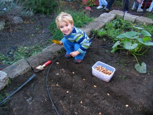 Kid playing in dirt.