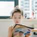 Girl reading book.